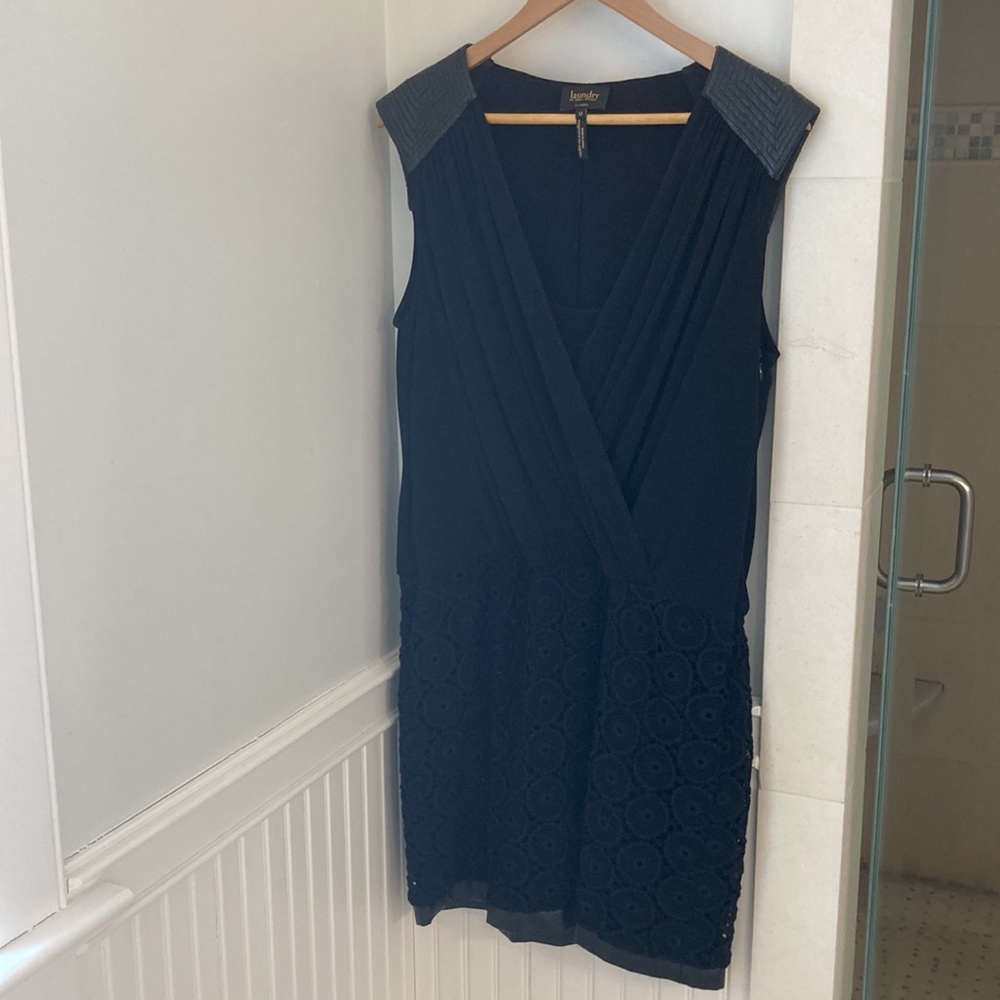 Black sleeveless dress with personality for a night out.